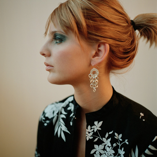 in studio portrait of musician tammy flynn, fashionable profile photo