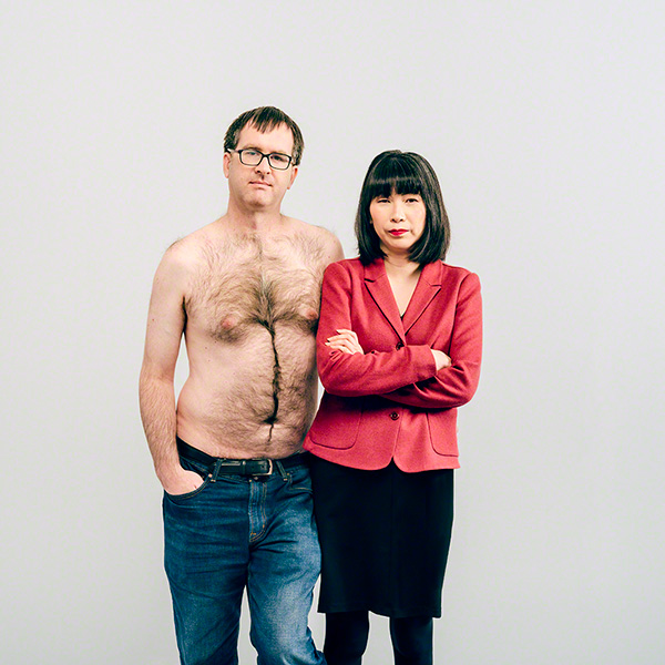 in studio portrait against white background, humorous, portrait of couple