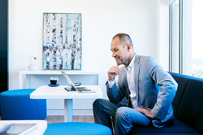 Great-West Life Insurance, on location in contemporary office, insurance advisor working digitally in virtual office, natural open light, clean