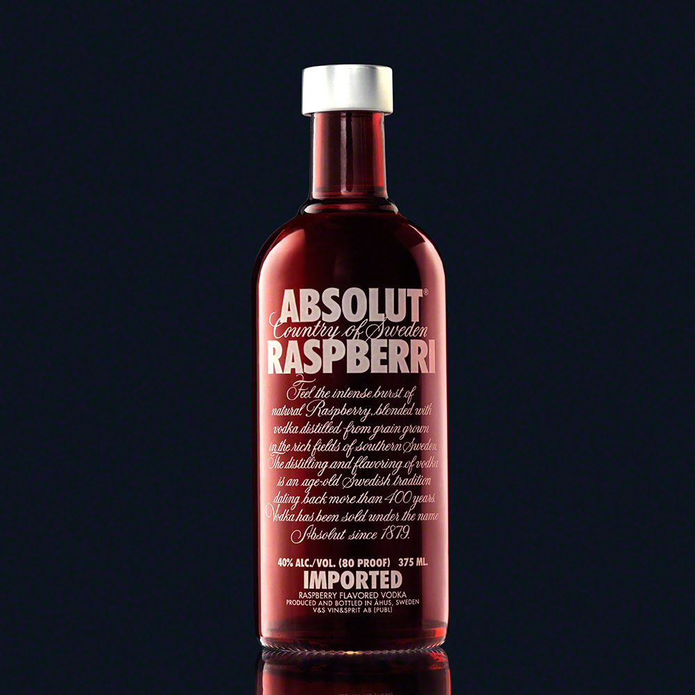 absolut raspberry vodka bottle on dark background, product photo, bottle photograph
