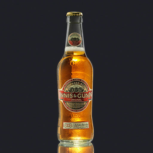 cold beer bottle on dark background, product photography