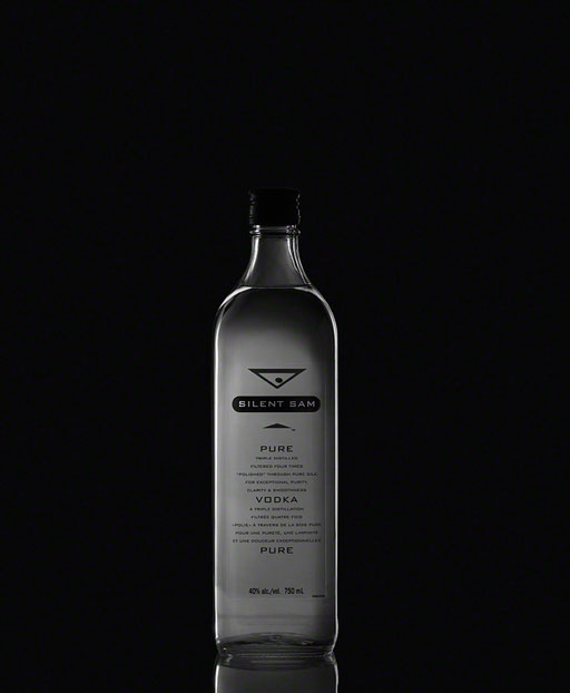 dramatic product photography of silent sam vodka bottle on dark background, bottle photo