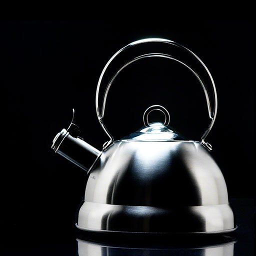 dramatic, graphic product photo, stainless steel tea pot on black background, housewares, home