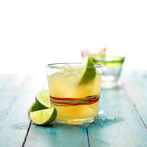 editorial cover photo of tequila cocktail in a mexican glass tumbler