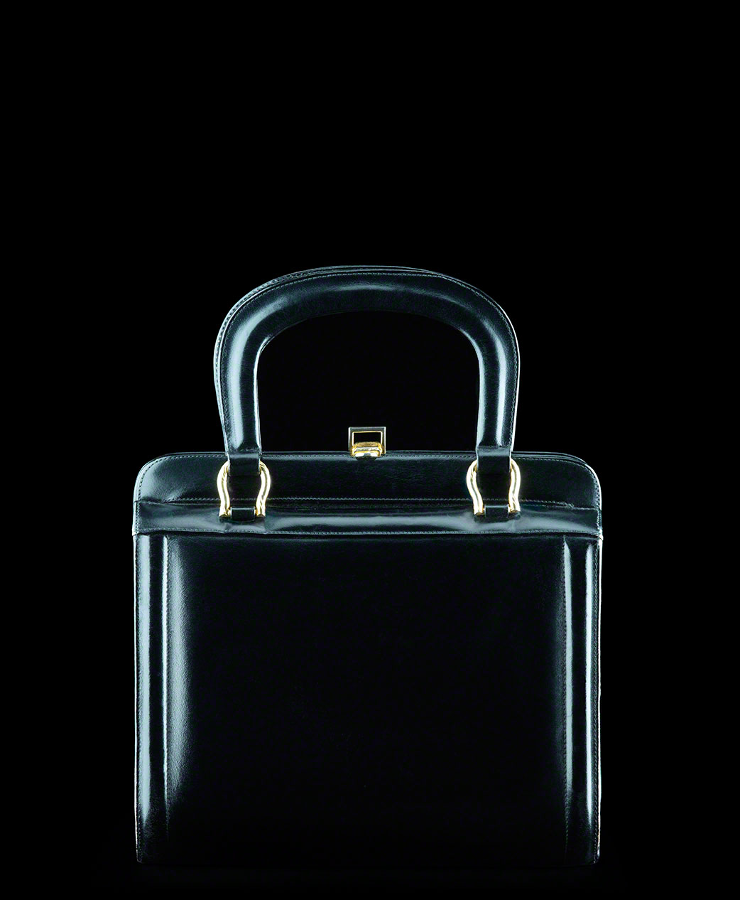 classic black vintage box purse, fashion still life, product photo, accessories, dramatic straight on shot