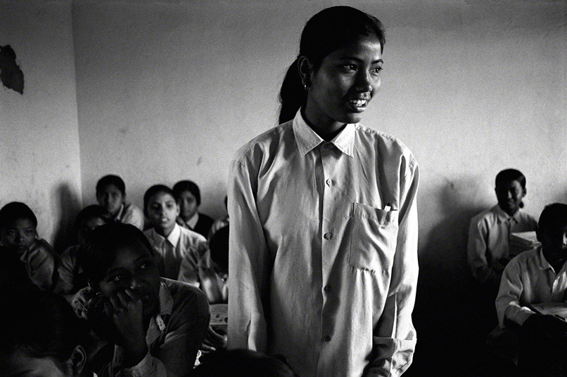 nepalese female teenage student reciting in class