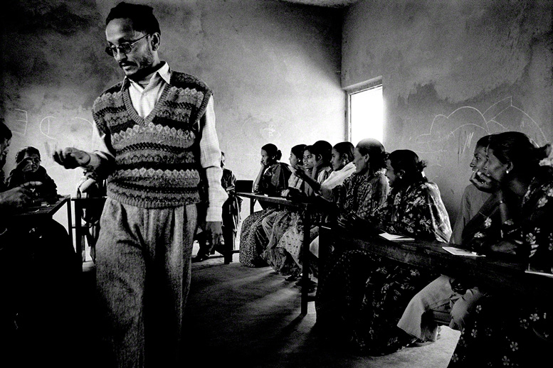 male teacher heads a women's education class in rural nepal